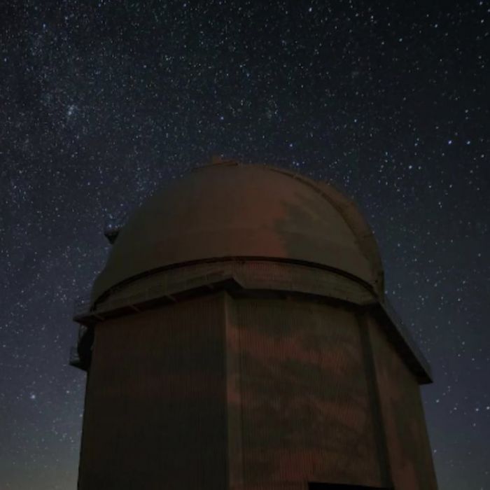 Giant professional telescope observing the night sky