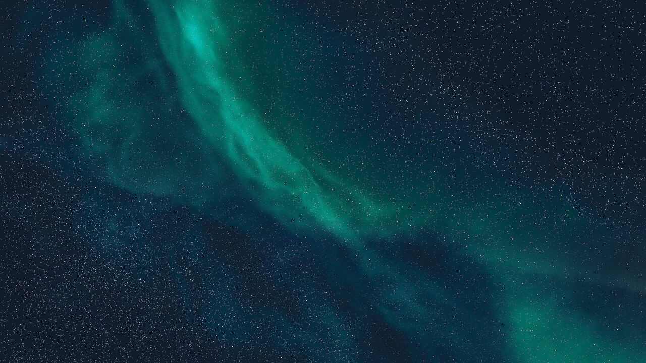 Green nebula over stars in the night sky