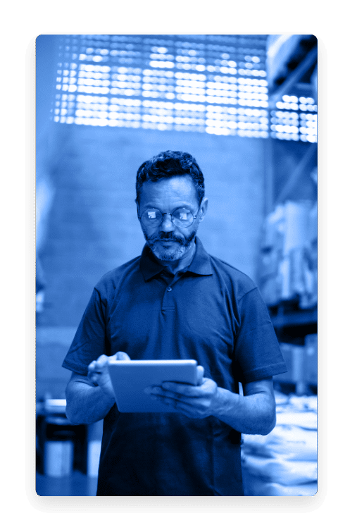 Man using a tablet in a warehouse