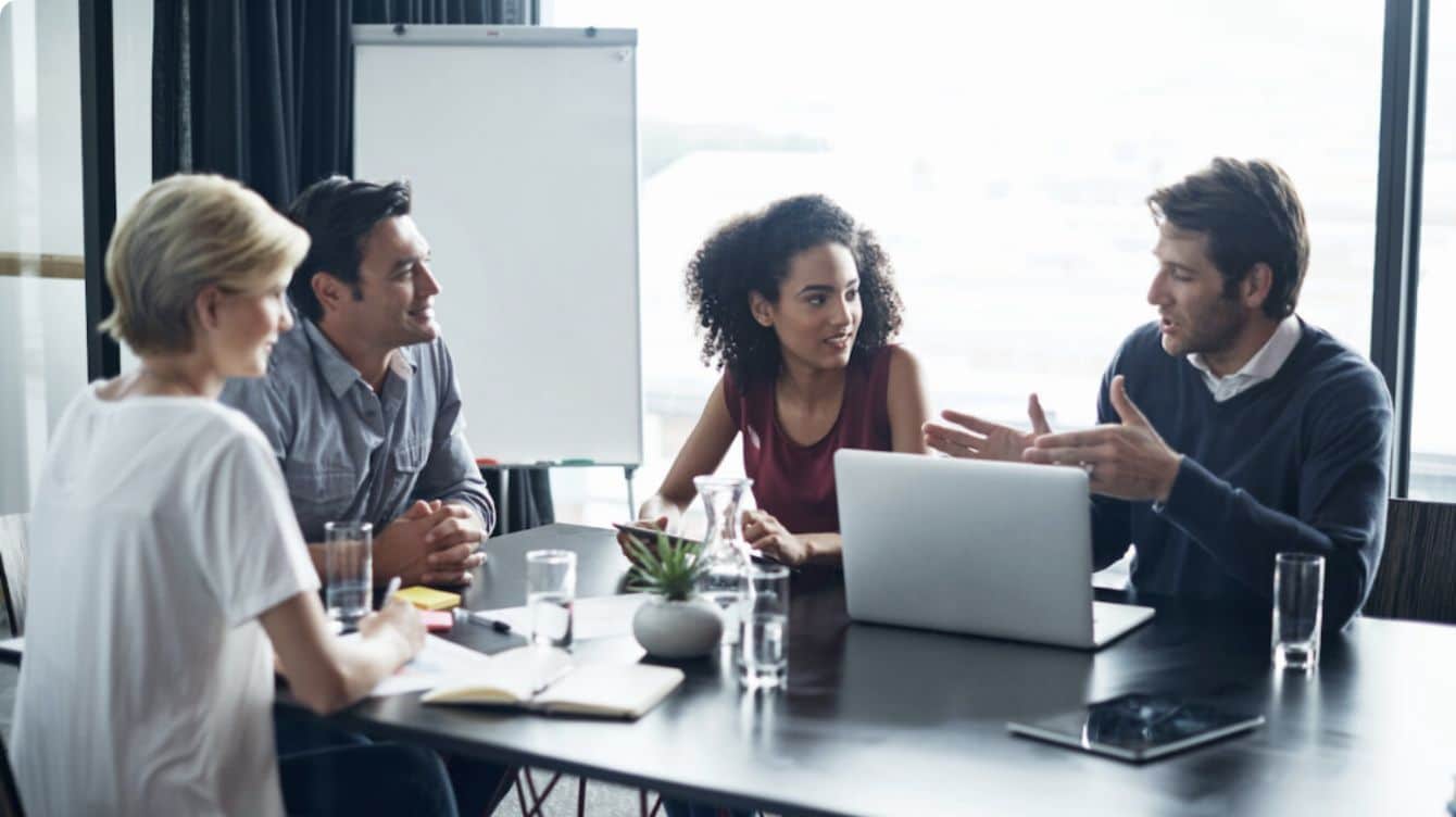 Men and women having a meeting in their office