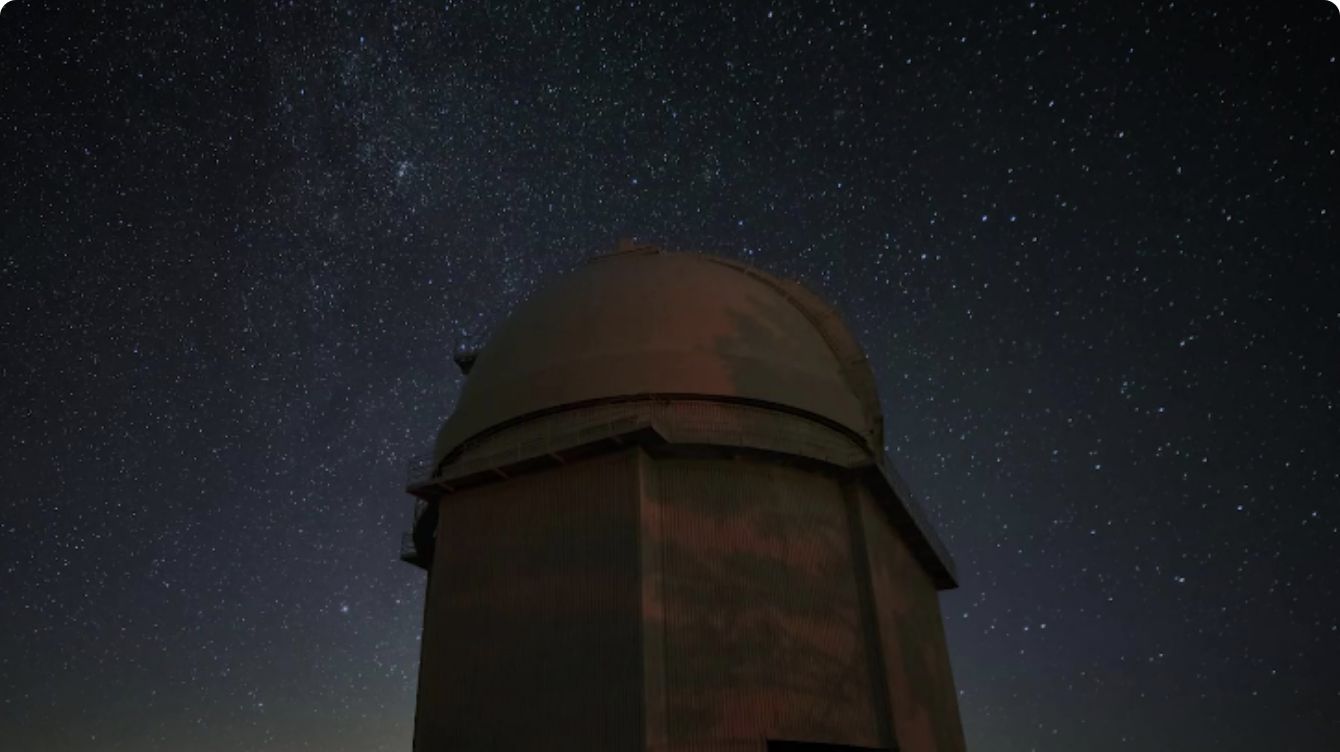 Giant professional telescope observing the night sky