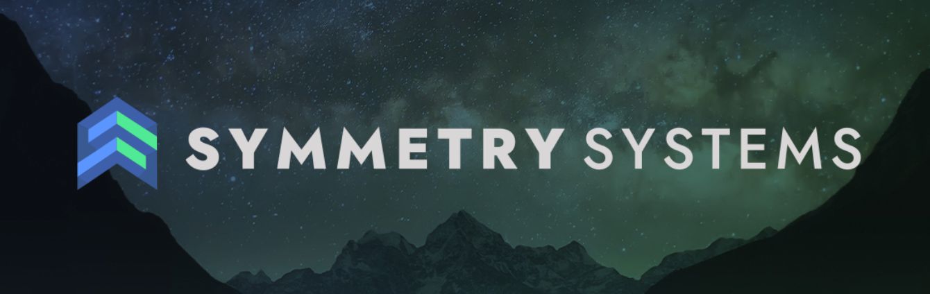 Symmetry Systems logo in front of mountains and night sky