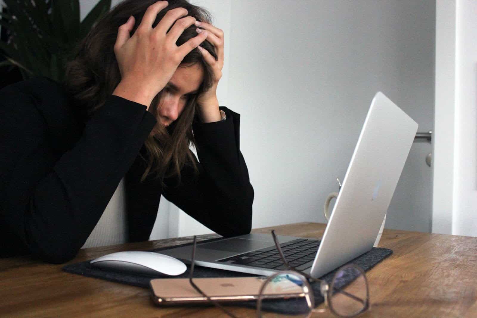 Woman frustrated working on her laptop