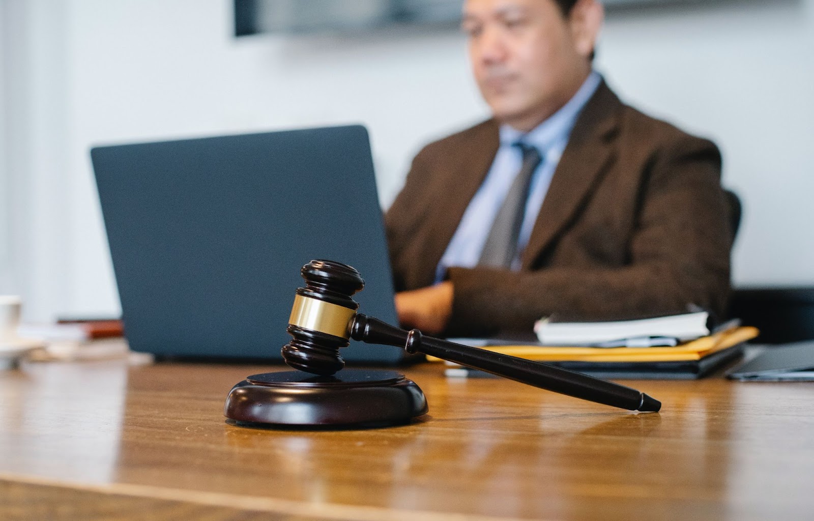 A judge working on his laptop