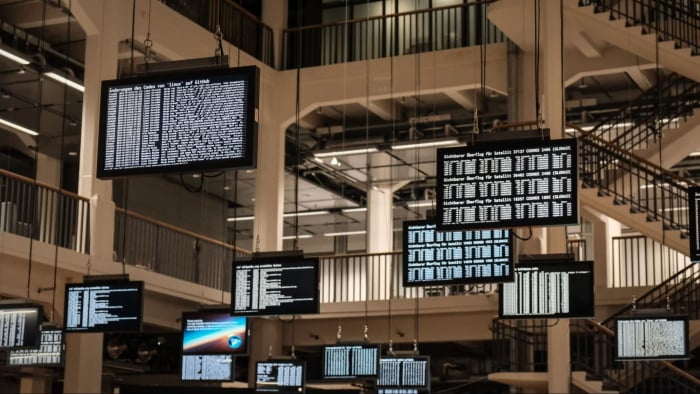 Multi-level building with hanging monitor screens